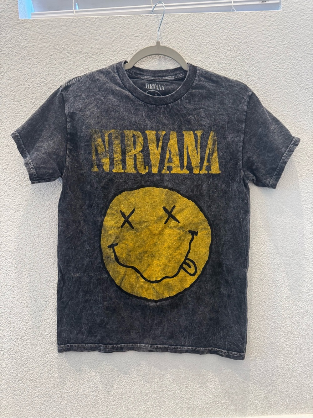 Black acid-wash Nirvana t-shirt w/ iconic yellow smiley face graphic